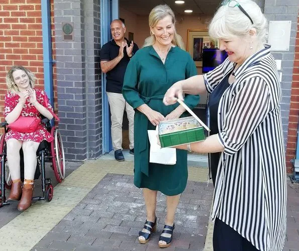 Disability Initiative is a charity supporting adults with complex physical disabilities. Sophie wore a green belted silk dress