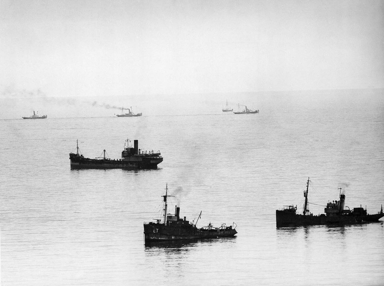 Allied minesweepers work to clear the English Channel while a convoy of evacuation ships head for Dunkirk.