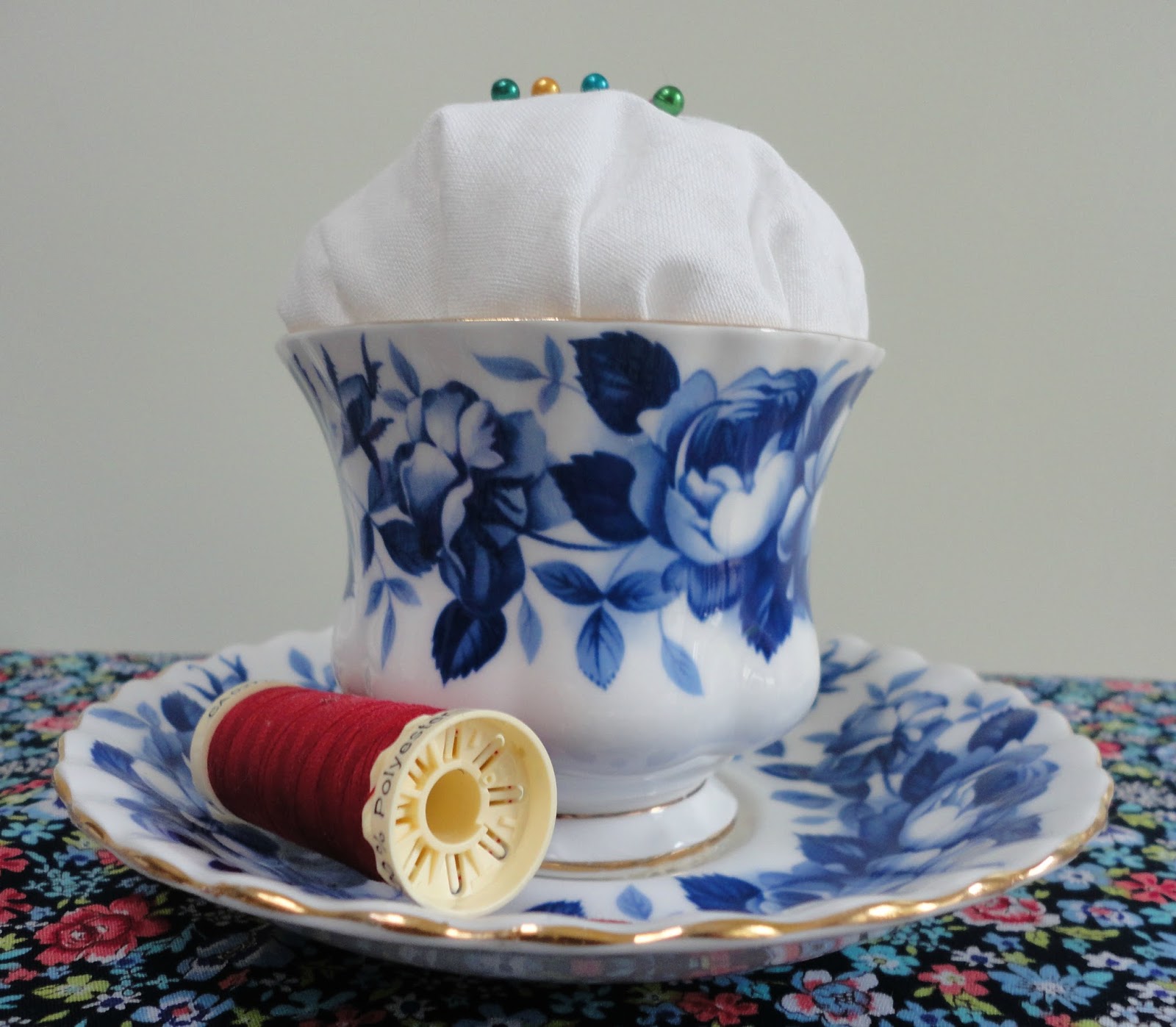 A vintage teacup pincushion