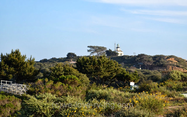 Green and rocky point beyond the gate to Cabillo Memorial