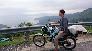 A tourist overlooks the ocean on the road between Hoian and Hue, Vietnam.