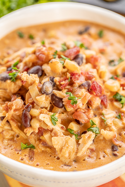 Slow Cooker Cream Cheese Crack Chicken Chili - this stuff is AMAZING! We've made it 3 times this month! We can't get enough of it!!! Chicken, corn, black beans, chicken broth, diced tomatoes and green chiles, cumin, chili powder, onion, ranch seasoning, bacon and cheddar cheese. We served the chili with some cornbread and Fritos. PERFECT! This is already on the menu again this weekend! YUM! #crockpot #slowcooker #chicken #chili Slow Cooker Cream Cheese Crack Chicken Chili - this stuff is AMAZING! We've made it 3 times this month! We can't get enough of it!!! Chicken, corn, black beans, chicken broth, diced tomatoes and green chiles, cumin, chili powder, onion, ranch seasoning, bacon and cheddar cheese. We served the chili with some cornbread and Fritos. PERFECT! This is already on the menu again this weekend! YUM! #crockpot #slowcooker #chicken #chili