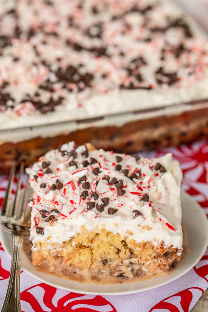 Peppermint Chocolate Chip Tres Leches Cake - dangerously delicious! Great for all your upcoming holiday parties!! Yellow cake mixed baked with candy canes and chocolate chips then soaked in three milks - sweetened condensed milk, half-and-half and evaporated milk. Top cake with whipped cream and more candy canes and chocolate chips. We could not stop eating this delicious cake! #dessert #peppermint #chocolatechips #candycakes #cake Peppermint Chocolate Chip Tres Leches Cake - dangerously delicious! Great for all your upcoming holiday parties!! Yellow cake mixed baked with candy canes and chocolate chips then soaked in three milks - sweetened condensed milk, half-and-half and evaporated milk. Top cake with whipped cream and more candy canes and chocolate chips. We could not stop eating this delicious cake! #dessert #peppermint #chocolatechips #candycakes #cake