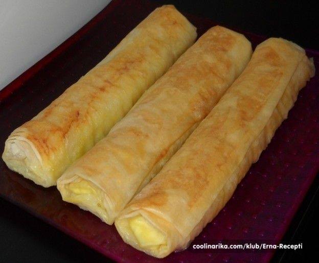 Slikovni rezultat za Sastojci 500 gr kora za pitu 300 gr sira 2 jajeta ulje so Premaz: paketić kvasca malo šećera so 3 jajeta 4 šoljice mlijeka 2 šoljice ulja 22 kašike mekog brašna