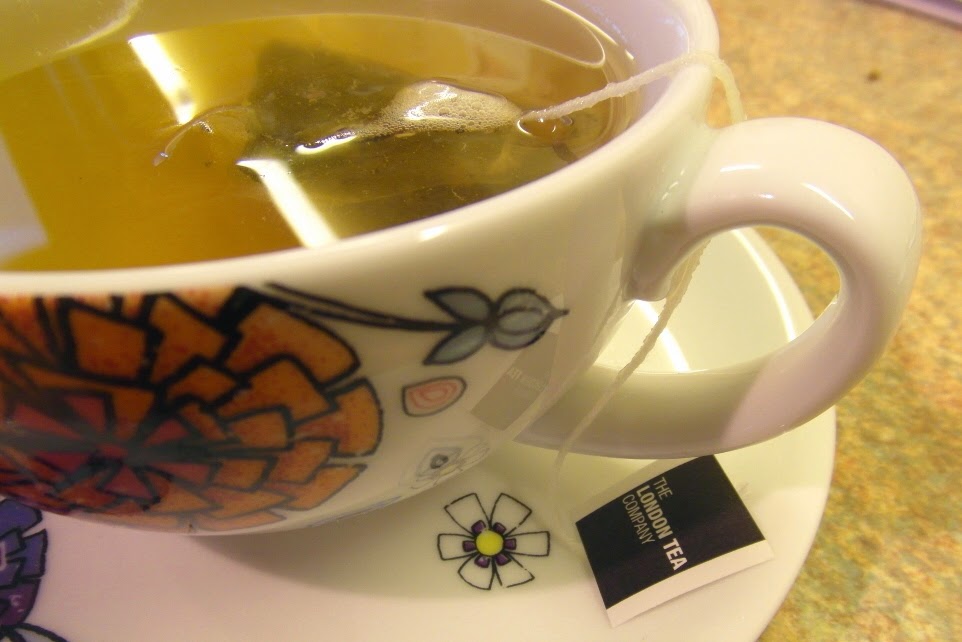 Tropical Green Tea pyramid in my favourite cup and saucer Tropical Green Tea pyramid in my favourite cup and saucer