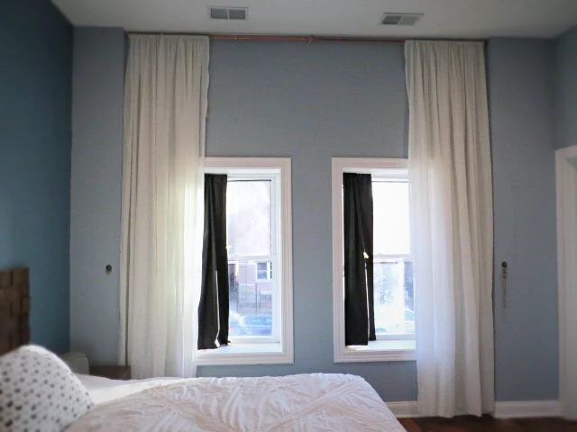 theatrical gauze extra long curtains in bedroom pushed open