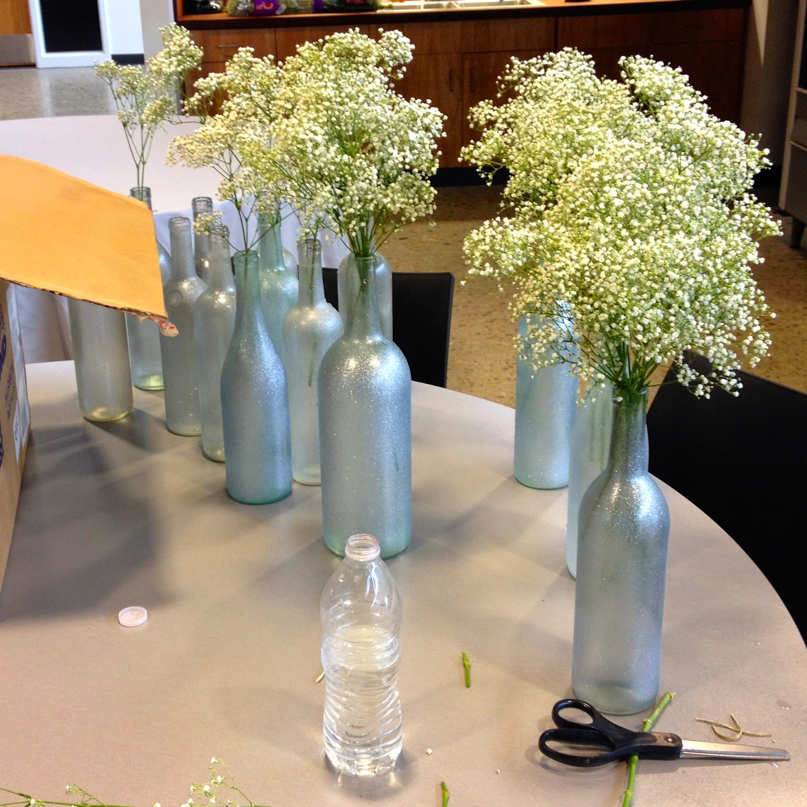 DIY Why Spend More Painted wine bottles for centerpieces