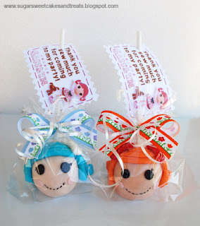 Customized cake pop doll heads with tags.