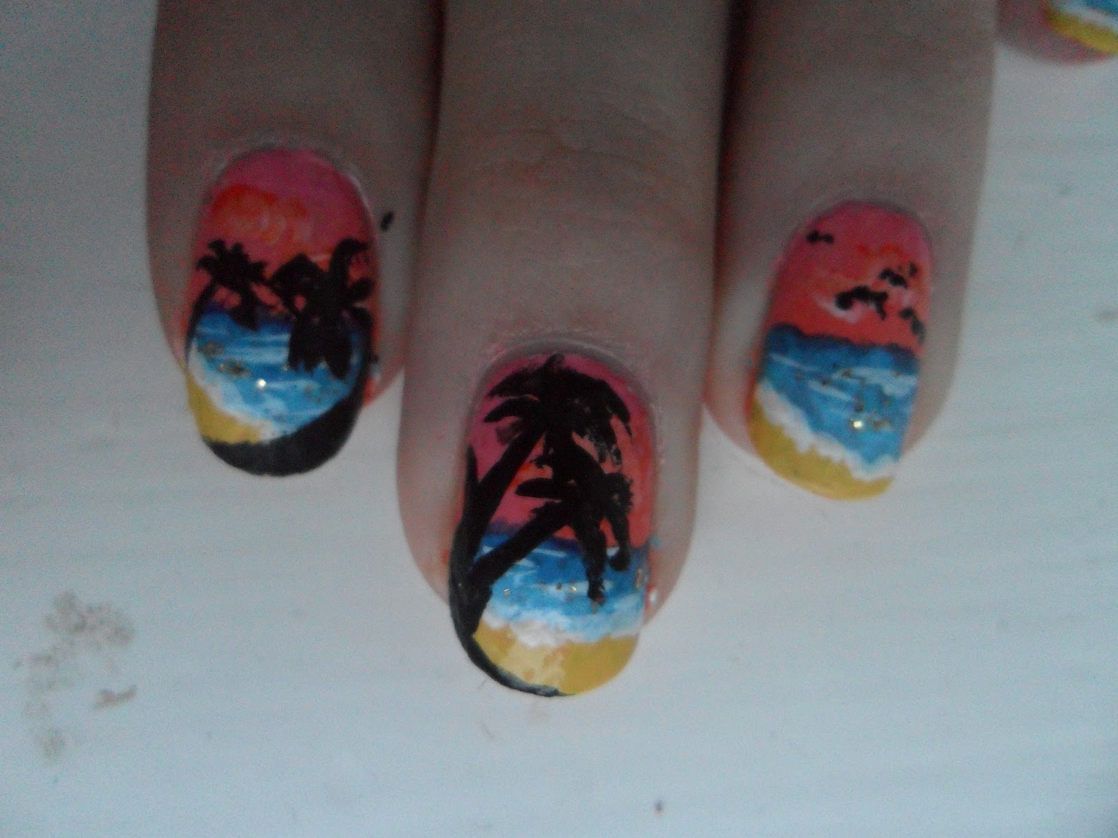 Sara Fisk; Nail Art: Sunset beach nails with palm trees and surfer guy