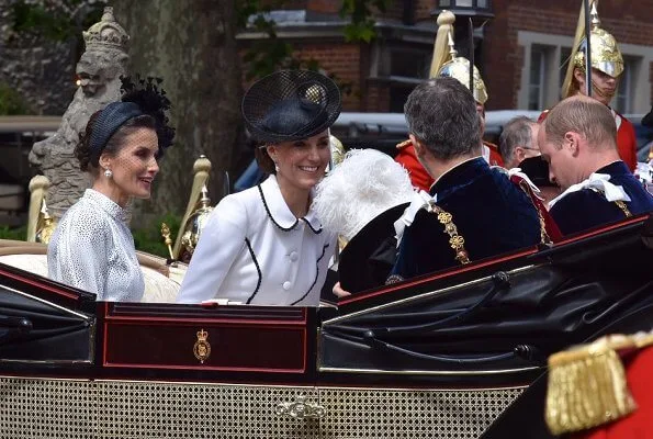 The Duchess is wearing Catherine Walker. Queen Maxima is wearing Claes Iversen. Queen Letizia wore a printed midi dress by Cherubina