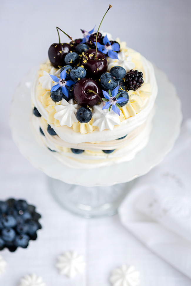 Meringue Stack Cake with Whipped Cream, Lemon Curd, and Berries