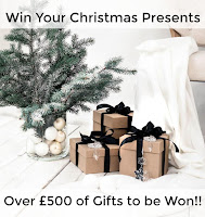 Win your Christmas Presents A Christmas scene, with a tree and a pile of presents beside it.