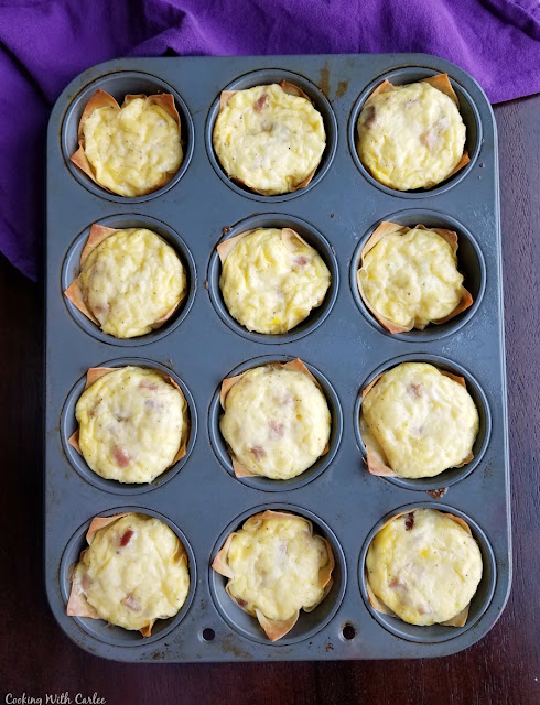 Small little individual sized quiche are perfect for serving brunch to a crowd. But these mini ham and cheese quiche are also great for a quick make ahead grab and go breakfast! baked mini ham and cheese quiche in cupcake tin fresh from oven