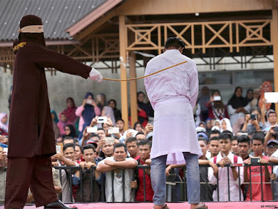 Public caning in Indonesia's Aceh province Public caning in Indonesia's Aceh province