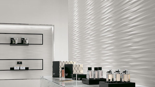 Tile design on wall with multi-faceted reliefs surfaces