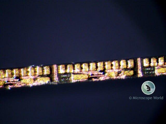 Image of a circuit captured under a stereo microscope at 90x magnification.