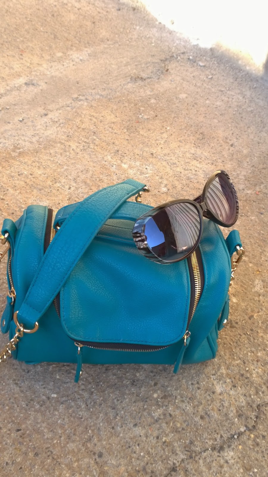 Funky handbag and animal print sunglasses