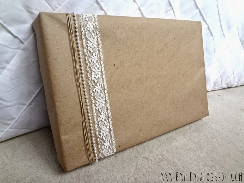 Brown paper gift wrap with lace, hemp, and pearl garland