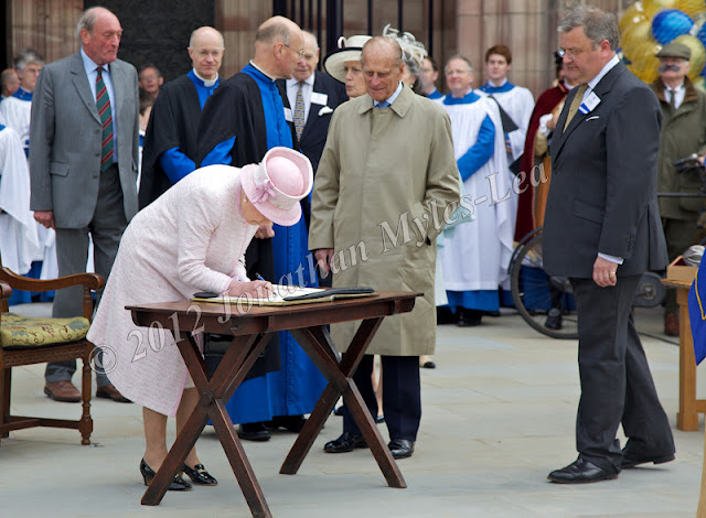 HM The Queen signing book at Hereford Cathedral. Photo © Jonathan Myles-Lea