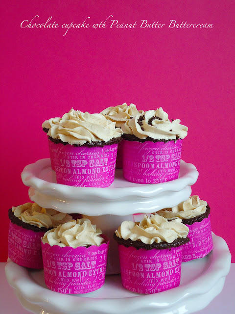 Chocolate Cupcakes with Peanut Butter Buttercream Chocolate cupcakes with peanut butter buttercream. The delicious combination of chocolate and peanut butter, baked into fluffy, moist cupcakes. This dessert recipe is a keeper! Get it from BlahnikBaker.com