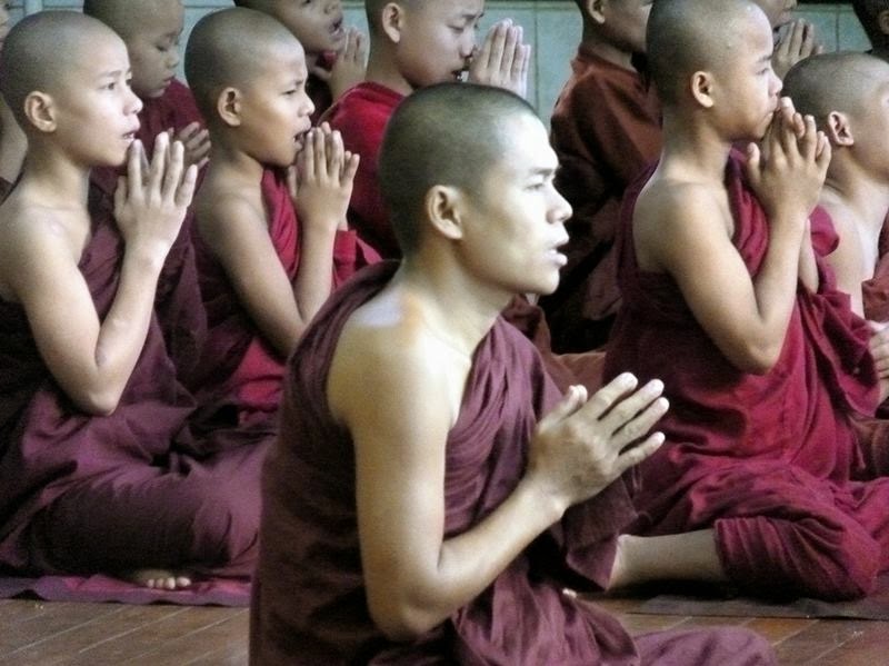 Monks in Kyaiktiyo Pagoda, Myanmar. June 2012.