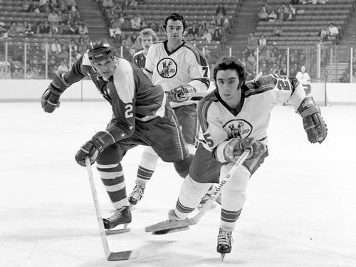 Jack and Randy at it again, as Guy Charron (7) watches; Charron would sign with Washington after the season