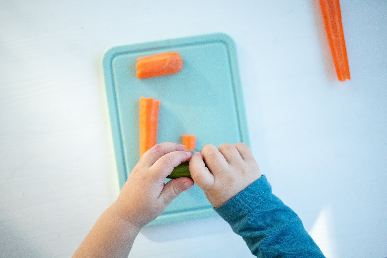 Here are some tips and tricks for introducing a wavy chopper knife to your toddler. This easy Montessori practical life tool can help encourage independence in the kitchen.
