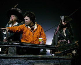 Gore Verbinski directing cast of Pirates of Caribbean -- Johnny Debb in background