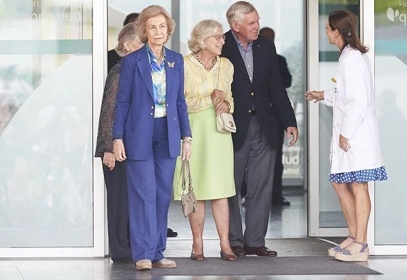 Queen Letizia wore Carolina Herrera navy ecru polka dot silk blouse. Queen Sofía and her sister, Princess Irene of Greece