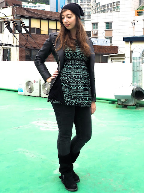Beanie & Boots | outfit of black leather jacket, green print top, grey jeans, tall black suede boots & beanie hat