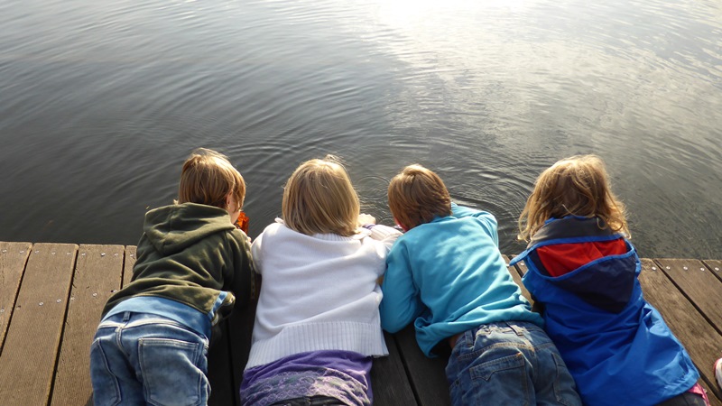 NAMC montessori classroom children with special needs. Kids looking at water on dock