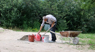 Sally mixing yet more cement Sally mixing yet more cement