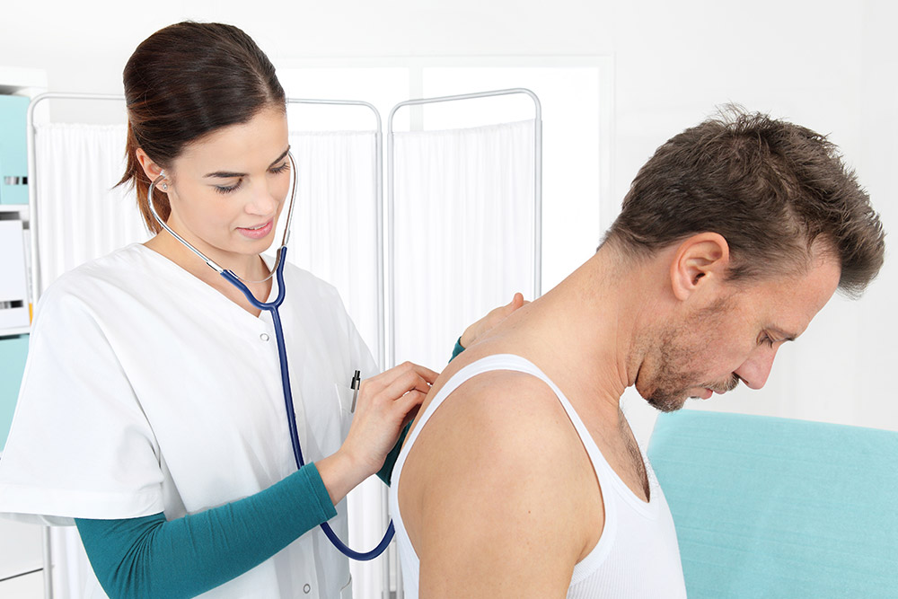 nurse examining lungs for COPD nurse examining lungs for COPD