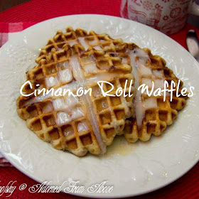 Cinnamon Roll Waffles from Adorned From Above - Ingredients: Grands Cinnamon Rolls, Butter,  Directions:  Heat up your waffle iron.  Using a pastry brush, brush some melted butter in the bottom of the waffle iron.  Place your cinnamon roll in the center of the waffle iron and then brush the top of the cinnamon roll with butter.  Push the top of the waffle iron down, and you may have to hold it in place for a minute, because the cinnamon roll will want to expand and push the top up.  You want it to be flat.  Cook it as you would a waffle and remove it when it is done.  My waffle iron has a light that goes off when it is done.  Remove the waffle from the waffle iron and brush with more melted butter.  Then spread some of the cinnamon roll frosting on top of the waffle.  I did this once I had the next waffle in the waffle iron.  Repeat this process for the rest of the waffles.  This makes 5 Cinnamon Roll Waffles with the Grands.