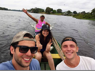 Four smiling in our boat