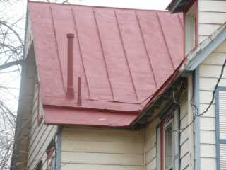 Before photo of old metal roof