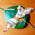 Cute Baby Krishna on Leaf Beautiful Pic