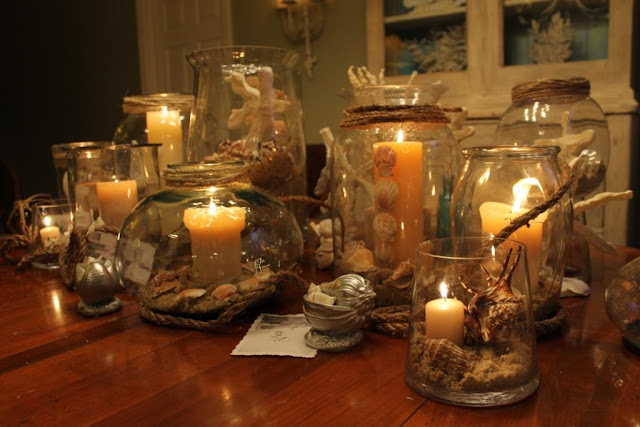Use glass vases, candles, shells, rope for stunning centerpiece