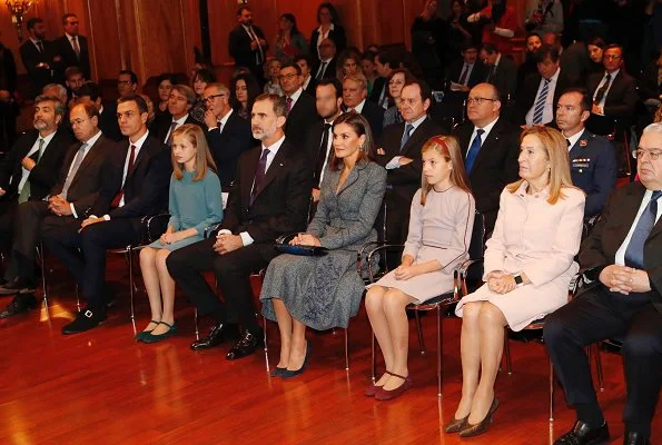 Queen Letizia wore Felipe Varela suit and Magrit Pumps, carried Hugo Boss Fanila clutch bag, Leonor and Sophia Carolina herrera dress