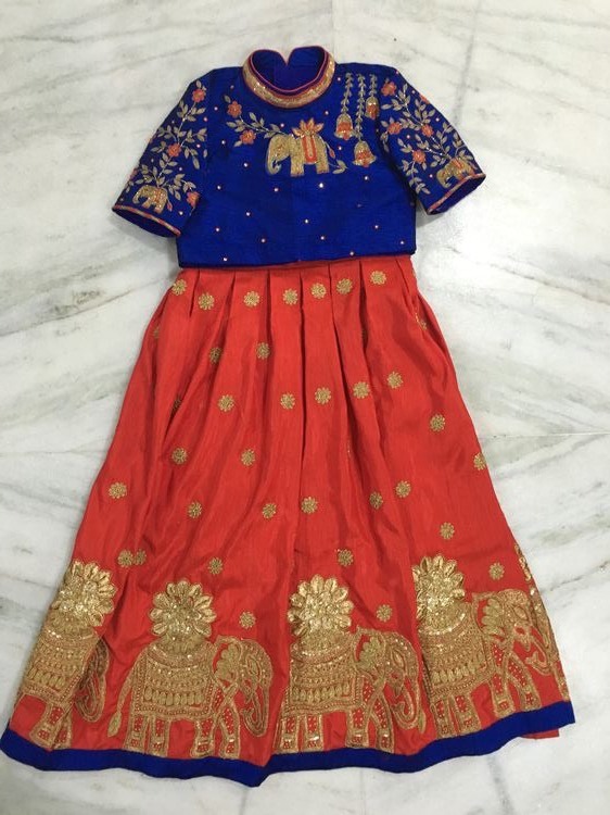 orange lehenga with blue blouse
