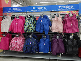 jackets on display under "thermal underwear" signs at a Walmart in Zhongshan