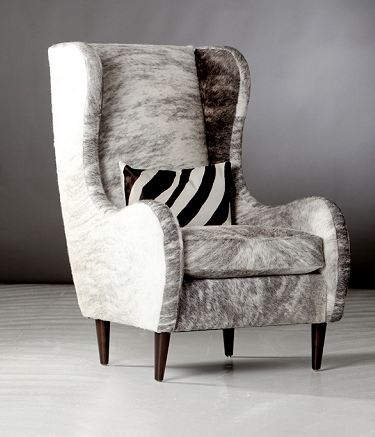 Feather grey hide upholstered wing back chair