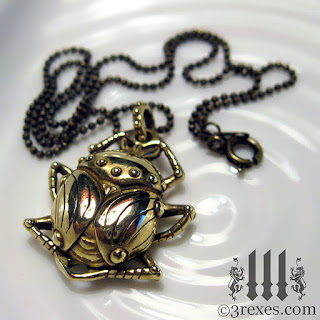 brass scarab beetle with ball chain