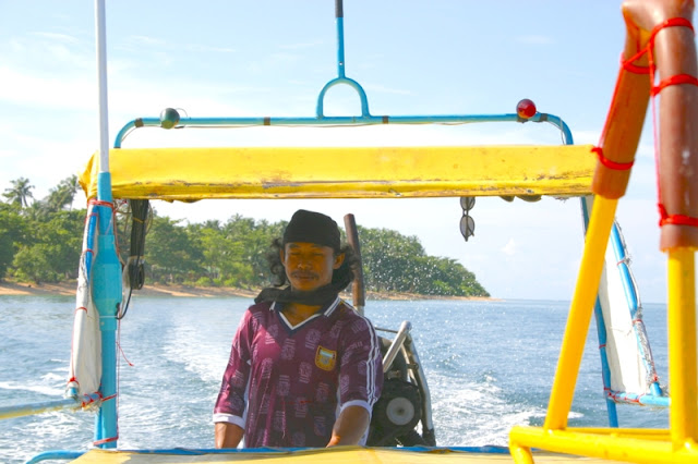 Leaving Kolibong Island by boat.