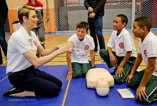 Princess Charlene of Monaco taught water safety and life saving first aid techniques after facing drowning danger to young rugby players who have come to Monaco from South Africa