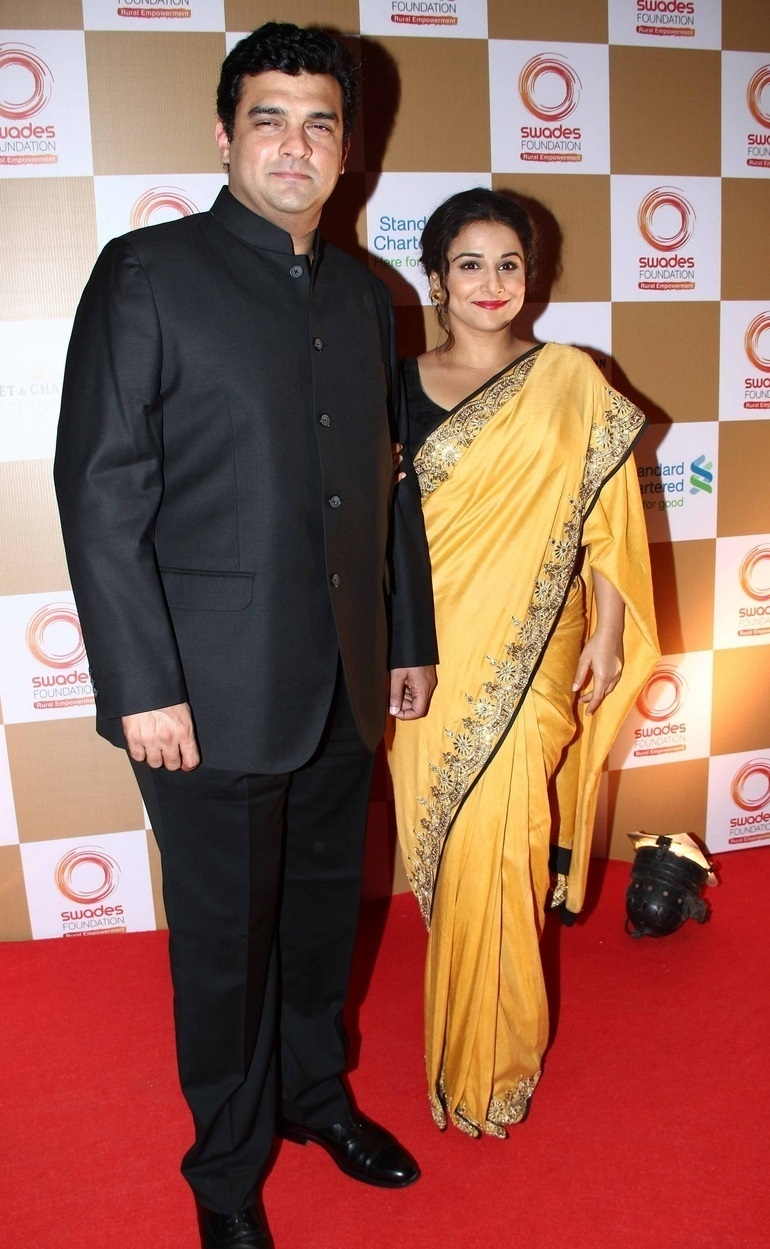 Actress Vidya Balan With Husband Siddharth Roy Photos In Yellow Sari