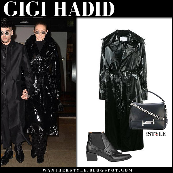 Gigi Hadid in black patent coat and black boots in New York on January 12