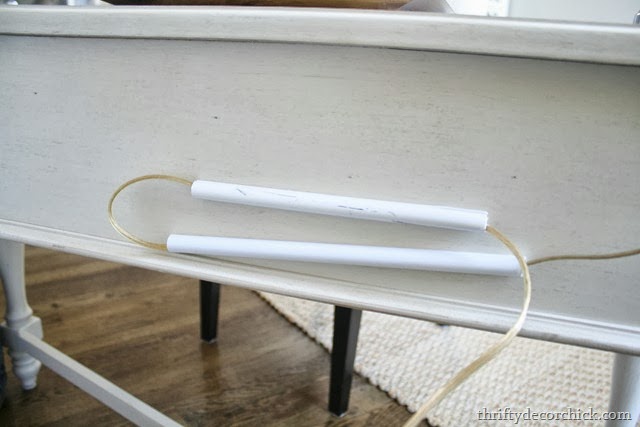 Hiding lamp cords behind furniture