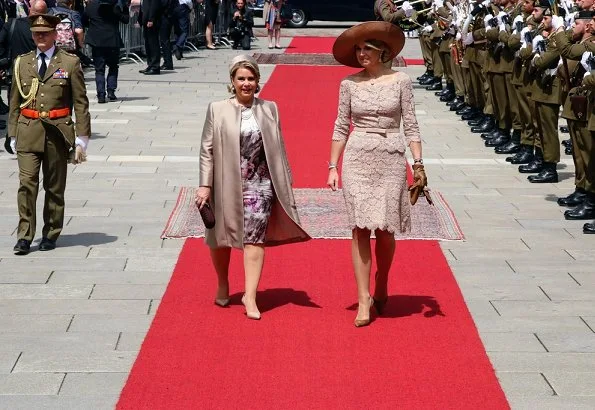 King Willem-Alexander and Queen Máxima, accompanied by Grand Duke Henri and Grand Duchess Maria Teresa. Valentino lace dress, diamond earrings