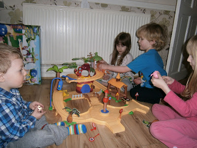 lots of children playing with the large jungle junction playset from flair plastic toys are sturdy and fun